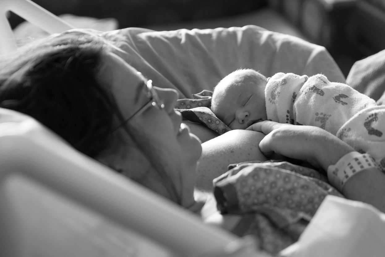 Newborn baby asleep on mom's chest, nursing photos