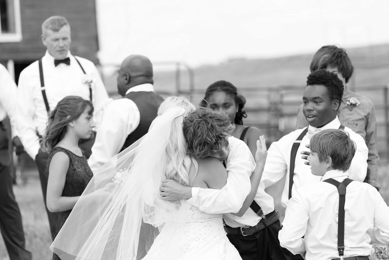 Son hugging bride, Colorado wedding photo journalism