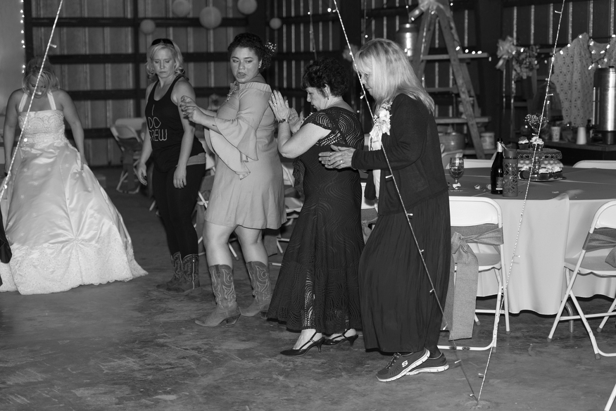 Grandmas line dancing at a wedding