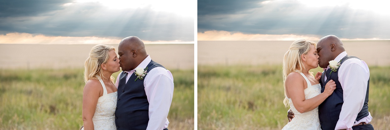 Bride and groom with a stormy sunset