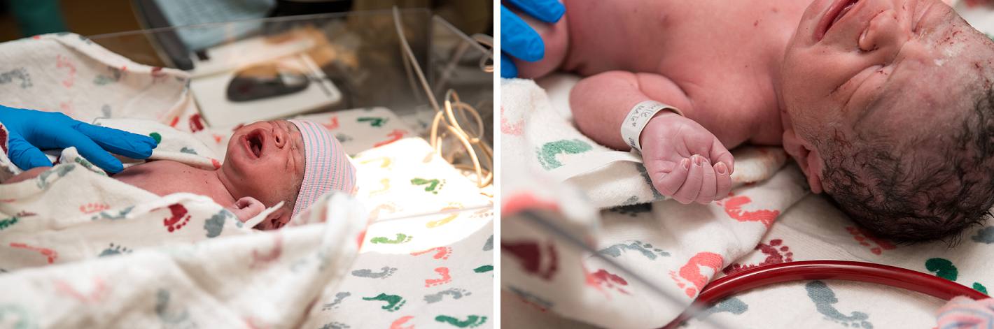 Newborn in an incubator with footprint blanket