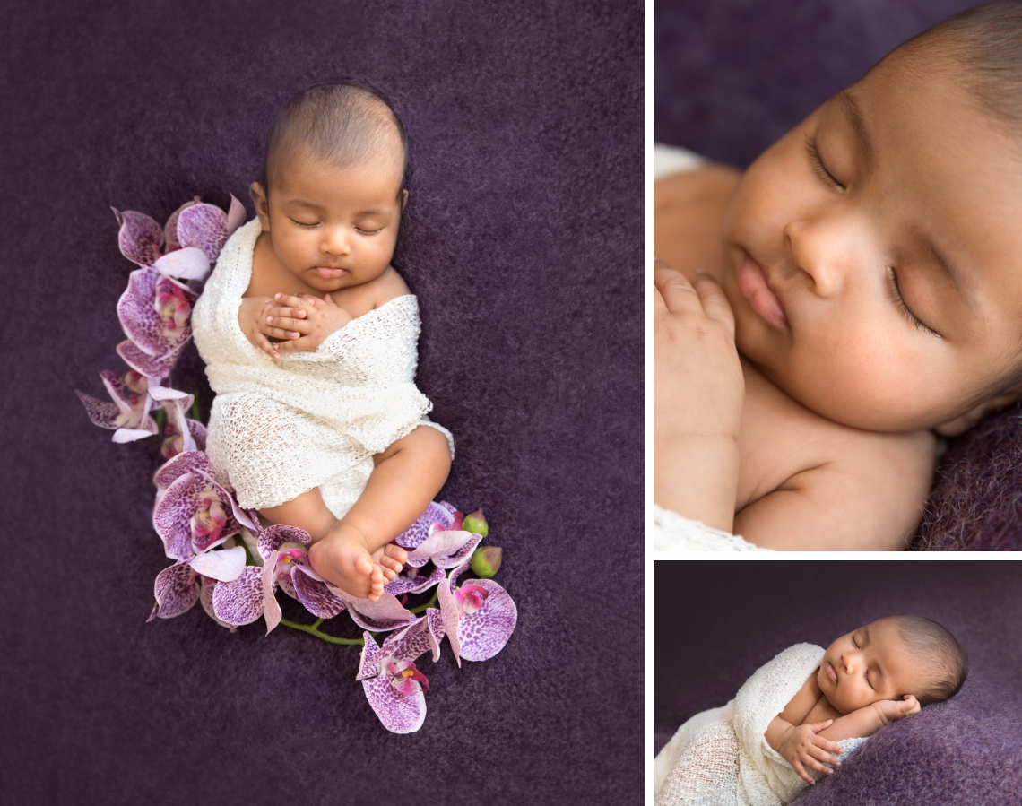 Newborn on an eggplant backdrop with purple orchid flowers