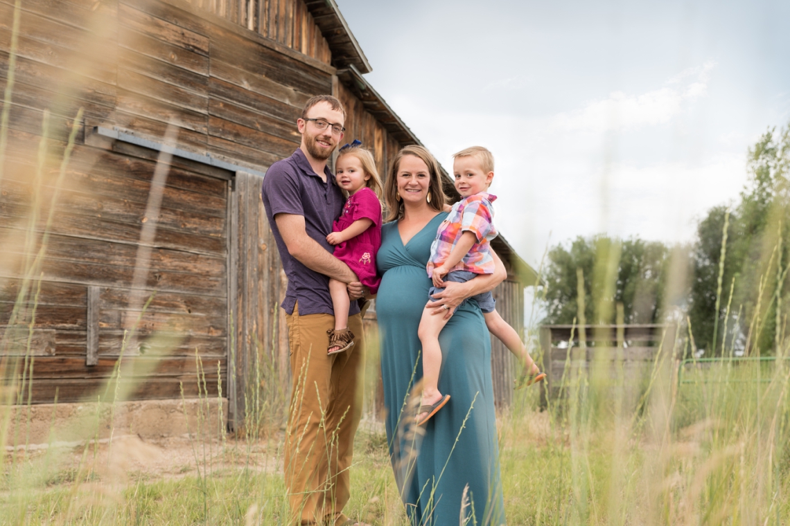 Family photos with jewel tone coordinated wardrobe, Sandstone Ranch Longmont Colorado