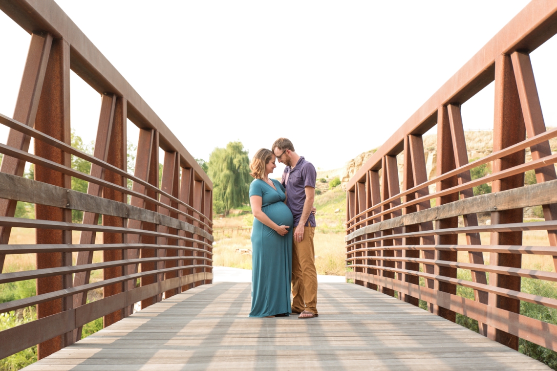 Sandstone Ranch maternity session, couple on bridge