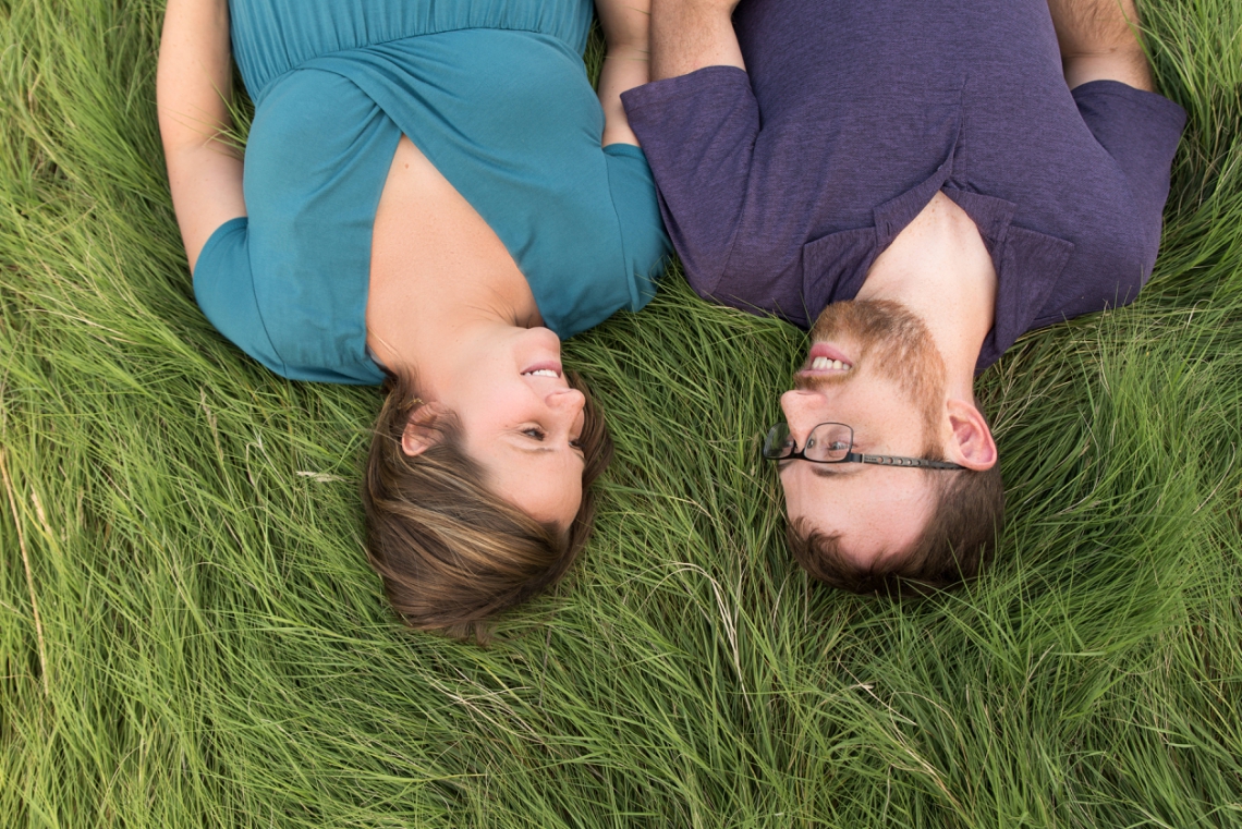Couple laying in the grass together