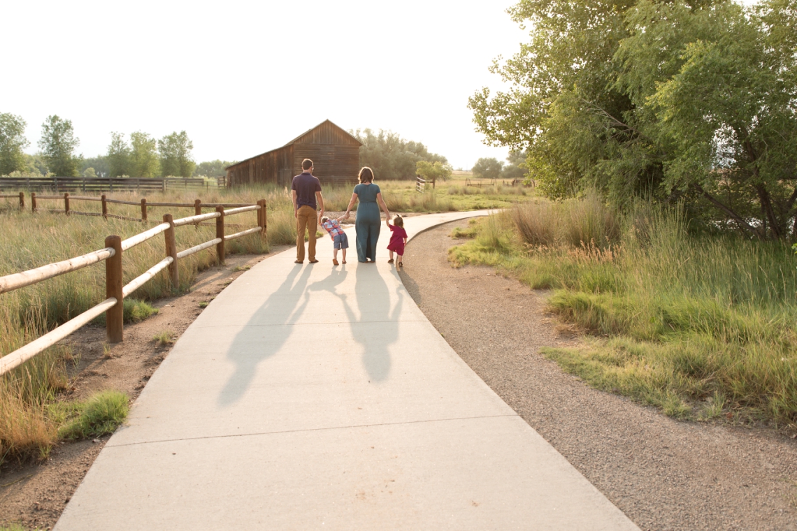 Family walking into the sunset at Sandstone Ranch