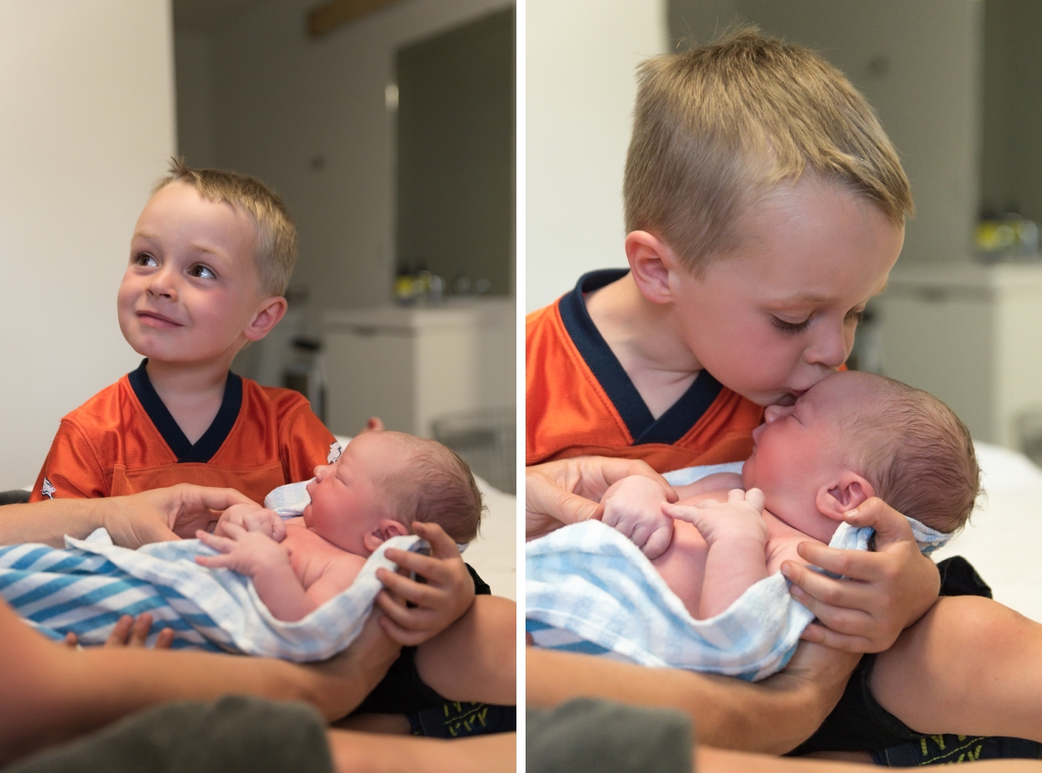 Brother meeting baby