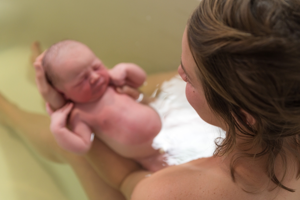 Birth photography herbal bath following birth