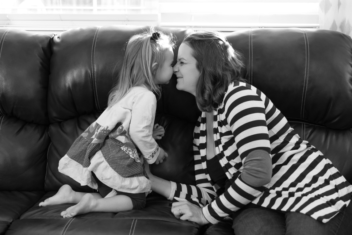 Eskimo kisses between mom and daughter