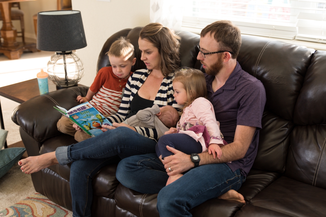 Family reading on the couch