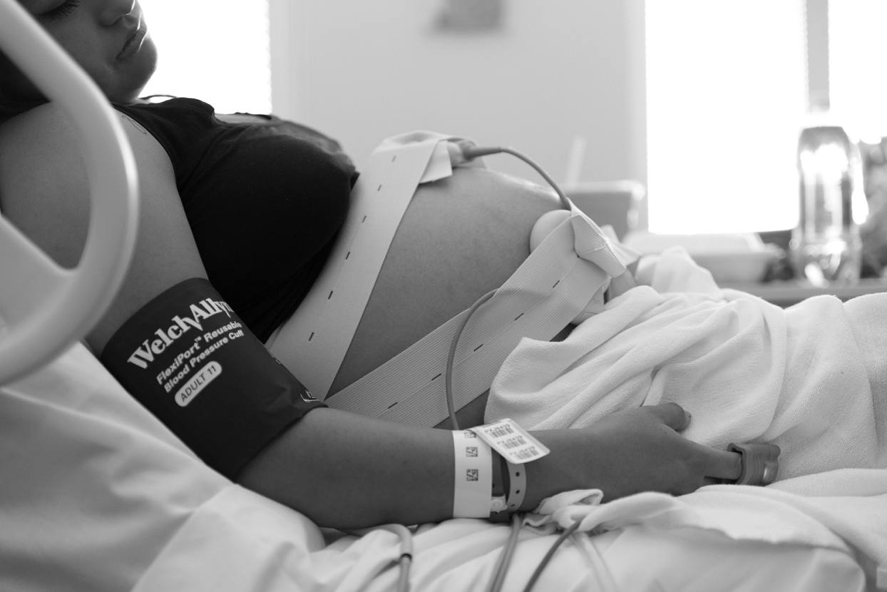 Profile view of woman in labor, Denver Health Birth Photography