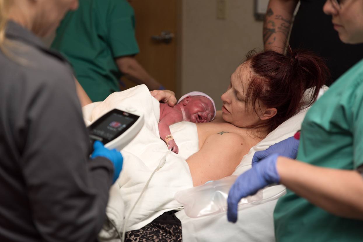Newborn on mother's chest, first skin on skin time