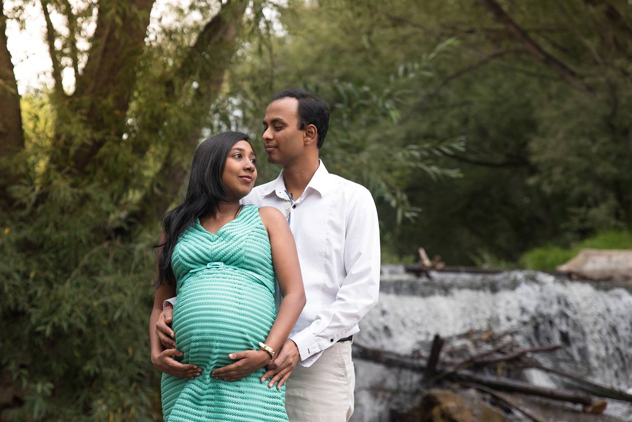 Waterfall maternity session at Golden Ponds in Longmont Colorado